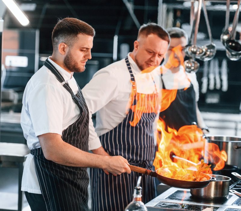 flaming-the-meal-on-frying-pan-kitchen-workers-is-together-preparing-the-food.jpg flaming-the-meal-on-frying-pan-kitchen-workers-is-together-preparing-the-food.jpg